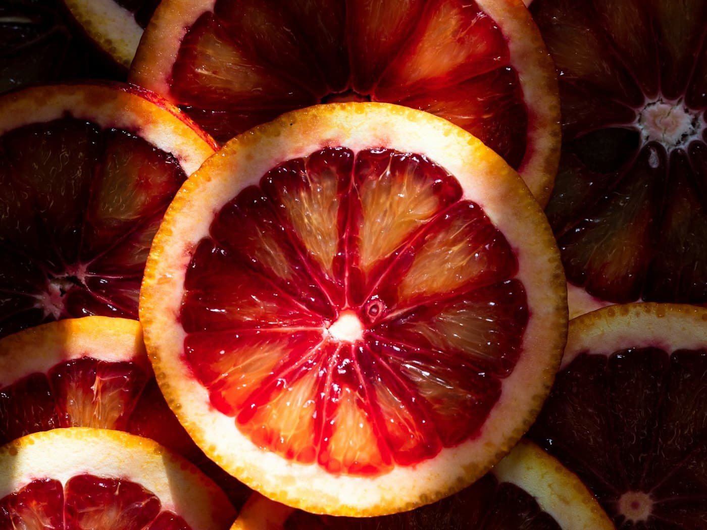 Sliced blood oranges showing deep crimson flesh